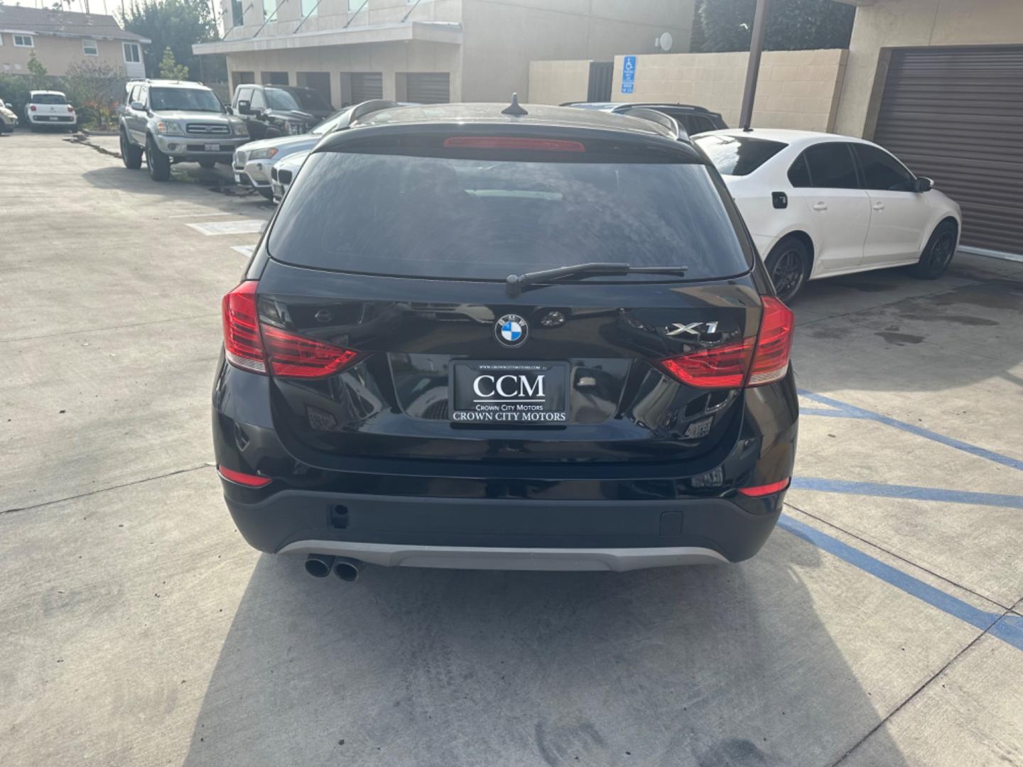 2014 Black /Black BMW X1 (WBAVM1C57EV) with an 4 CYLINDER engine, Automatic transmission, located at 30 S. Berkeley Avenue, Pasadena, CA, 91107, (626) 248-7567, 34.145447, -118.109398 - Photo#4